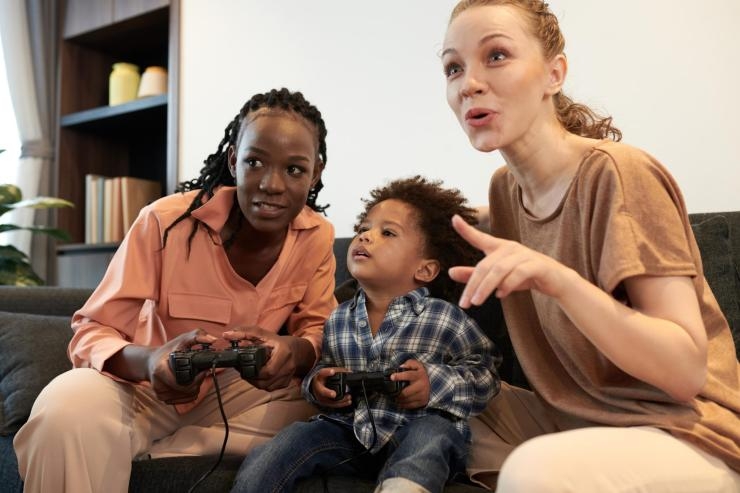 diverse parents and son playing video game 2023 11 27 05 28 14 utc 2048x1365