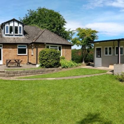 Eden School Macclesfield picture looking at school from the back garden 2048x667